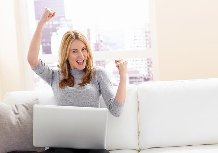 A lady punching the air after reserving her hot iron area franchise