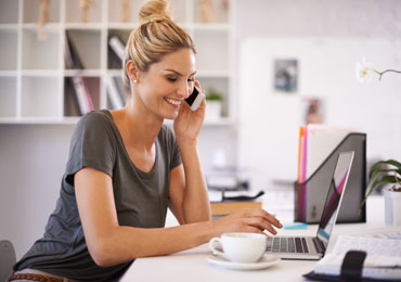 Women on the phone talking to a Hot Iron customer